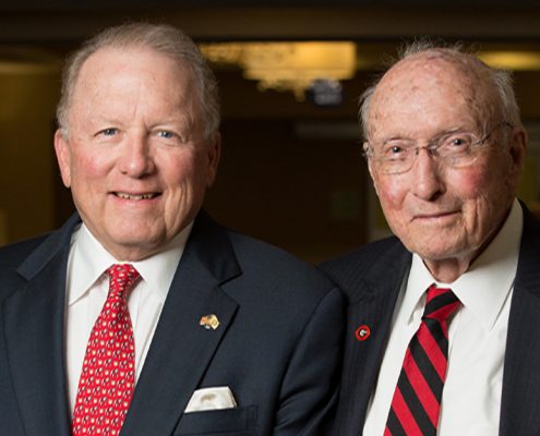 Larry R. Benson (BBA '74) and father H.E. "Ed" Benson (BBA '42)